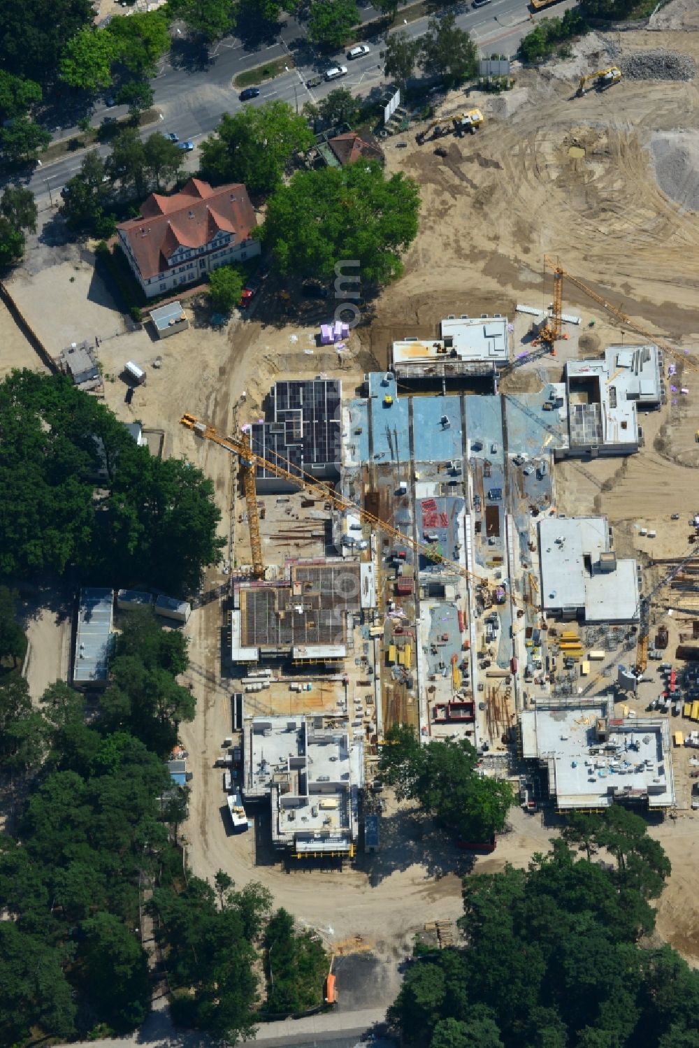 Berlin OT Dahlem from the bird's eye view: Construction site for a residential area in Clayallee in the district of Steglitz-Zehlendorf in Berlin. The project is located on site of the former orthopedics clinic and home. The project is run by OHA Projektentwicklungsgesellschaft