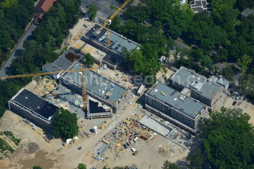 Aerial photograph Berlin OT Dahlem - Construction site for a residential area in Clayallee in the district of Steglitz-Zehlendorf in Berlin. The project is located on site of the former orthopedics clinic and home. The project is run by OHA Projektentwicklungsgesellschaft