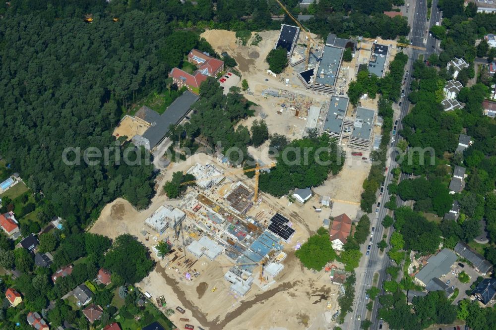 Aerial photograph Berlin OT Dahlem - Construction site for a residential area in Clayallee in the district of Steglitz-Zehlendorf in Berlin. The project is located on site of the former orthopedics clinic and home. The project is run by OHA Projektentwicklungsgesellschaft