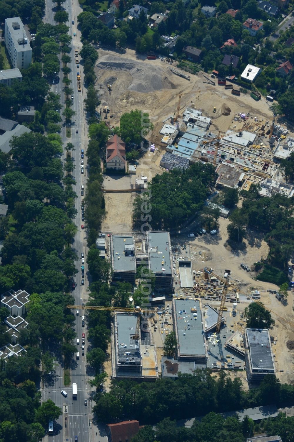 Berlin OT Dahlem from the bird's eye view: Construction site for a residential area in Clayallee in the district of Steglitz-Zehlendorf in Berlin. The project is located on site of the former orthopedics clinic and home. The project is run by OHA Projektentwicklungsgesellschaft