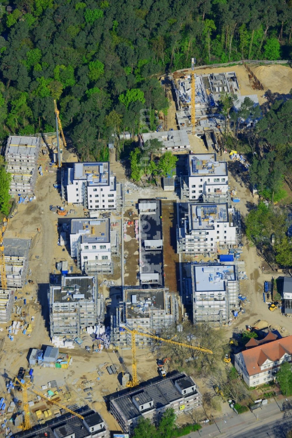 Aerial photograph Berlin , Dahlem - Construction site for a residential area in Clayallee in the district of Steglitz-Zehlendorf in Berlin. The project is located on site of the former orthopedics clinic and home. The project is run by OHA Projektentwicklungsgesellschaft