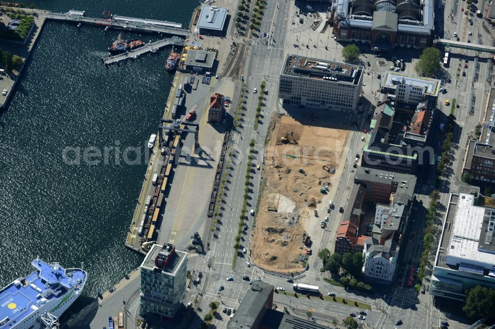 Kiel from the bird's eye view: Construction site for the new building of the Central Omnibus Station ZOB in Kiel in the state of Schleswig-Holstein. The construction site is located on Schwedenkai. The new bus station and a parking lot is being built