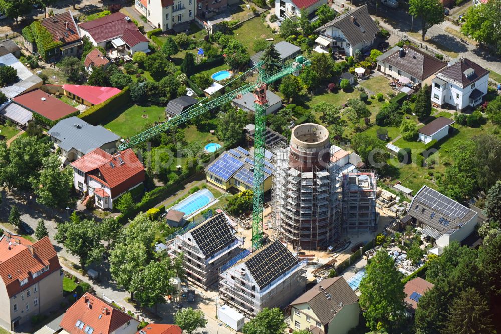 Berlin from above - Construction site for the construction of two new residential buildings and conversion of the water tower into a residential building on Schirnerstrasse in the district of Altglienicke in Berlin, Germany