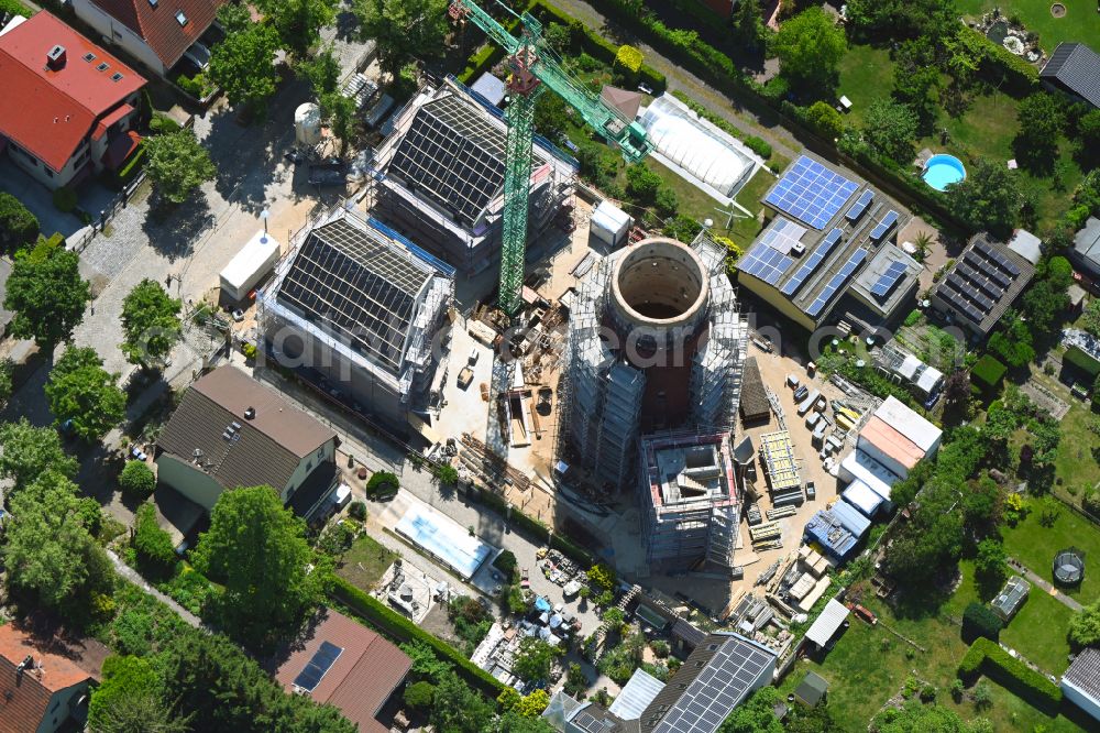 Aerial image Berlin - Construction site for the construction of two new residential buildings and conversion of the water tower into a residential building on Schirnerstrasse in the district of Altglienicke in Berlin, Germany