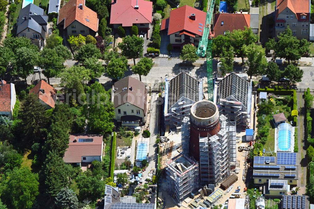 Berlin from above - Construction site for the construction of two new residential buildings and conversion of the water tower into a residential building on Schirnerstrasse in the district of Altglienicke in Berlin, Germany