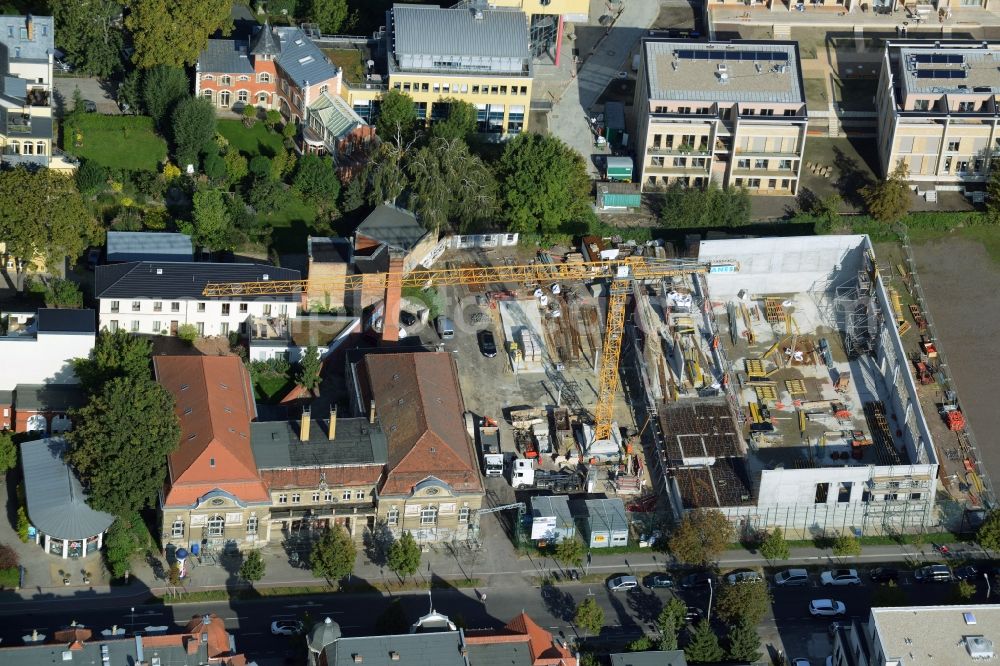 Aerial image Potsdam - Construction site for the new building of a sports hall and facilities in Kurfuerstenstrasse in Potsdam in the state of Brandenburg. The project is being developed by Baurconsult and borders a historic building and sports ground