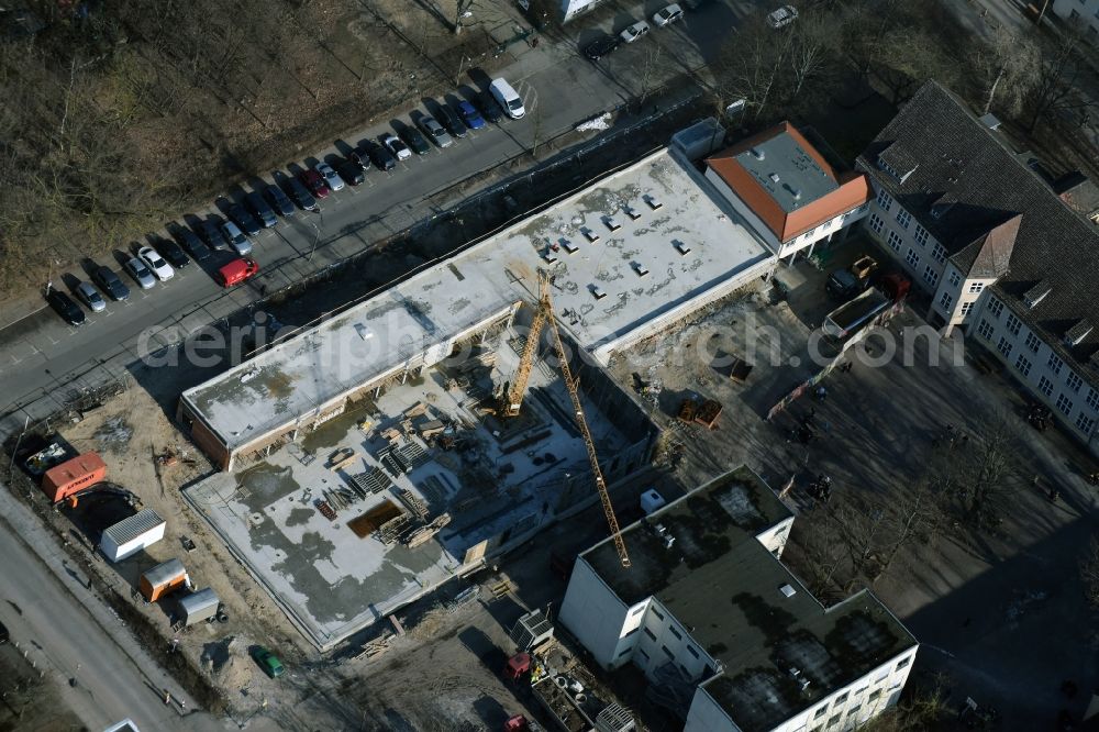 Berlin from above - Construction of a two-storey hall sports hall at the school building of the Hans-and-Hilde-Coppi-Gymnasium at the Roemerweg in the district Karlshorst in Berlin