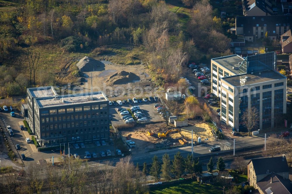 Bochum from above - Construction site for the new building project Seven Stones on Universitaetsstrasse in Bochum in the state of North Rhine-Westphalia. The police station Southeast is the first completed building of the area