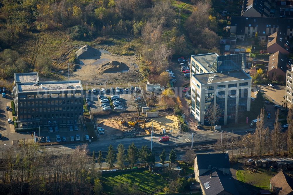 Bochum from the bird's eye view: Construction site for the new building project Seven Stones on Universitaetsstrasse in Bochum in the state of North Rhine-Westphalia. The police station Southeast is the first completed building of the area