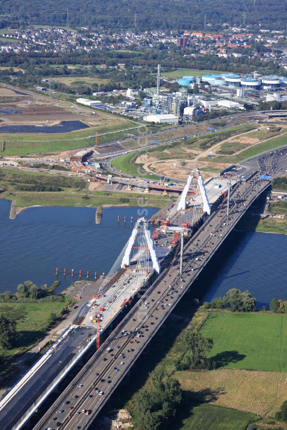 Aerial photograph Leverkusen - Construction site for the renovation, renewal and repair of the motorway bridge structure of the BAB A1 Leverkusen Rhine Bridge in Leverkusen in the federal state of North Rhine-Westphalia, Germany. Further information from: Autobahn GmbH des Bundes Westfalen Zweigniederlassung, HOCHTIEF Aktiengesellschaft AG, Landesbetrieb Strassenbau Nordrhein-Westfalen, PORR Deutschland GmbH, SEH Engineering GmbH