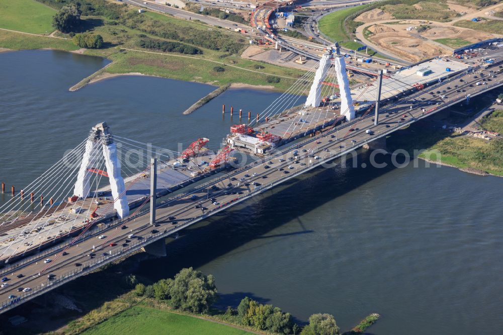 Leverkusen from the bird's eye view: Construction site for the renovation, renewal and repair of the motorway bridge structure of the BAB A1 Leverkusen Rhine Bridge in Leverkusen in the federal state of North Rhine-Westphalia, Germany. Further information from: Autobahn GmbH des Bundes Westfalen Zweigniederlassung, HOCHTIEF Aktiengesellschaft AG, Landesbetrieb Strassenbau Nordrhein-Westfalen, PORR Deutschland GmbH, SEH Engineering GmbH