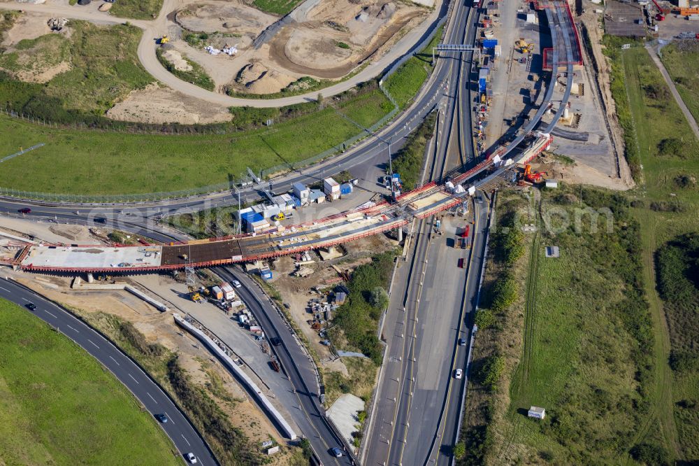 Leverkusen from the bird's eye view: Construction site for the renovation, renewal and repair of the motorway bridge structure of the BAB A1 Leverkusen Rhine Bridge in Leverkusen in the federal state of North Rhine-Westphalia, Germany. Further information from: Autobahn GmbH des Bundes Westfalen Zweigniederlassung, HOCHTIEF Aktiengesellschaft AG, Landesbetrieb Strassenbau Nordrhein-Westfalen, PORR Deutschland GmbH, SEH Engineering GmbH