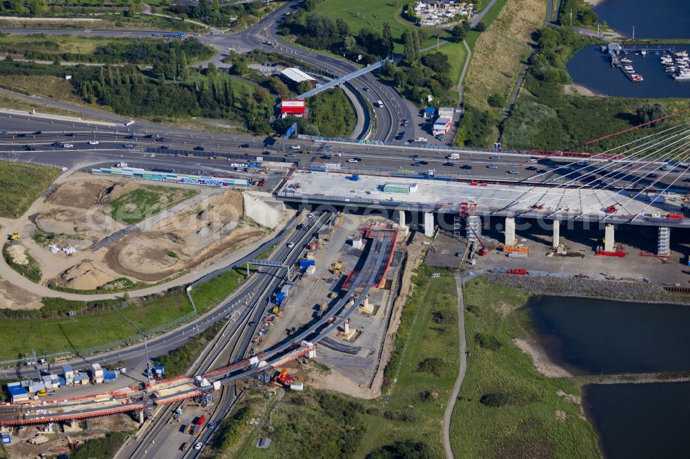 Aerial photograph Leverkusen - Construction site for the renovation, renewal and repair of the motorway bridge structure of the BAB A1 Leverkusen Rhine Bridge in Leverkusen in the federal state of North Rhine-Westphalia, Germany. Further information from: Autobahn GmbH des Bundes Westfalen Zweigniederlassung, HOCHTIEF Aktiengesellschaft AG, Landesbetrieb Strassenbau Nordrhein-Westfalen, PORR Deutschland GmbH, SEH Engineering GmbH