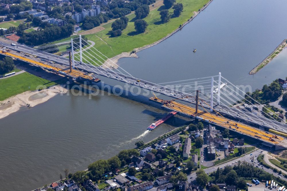 Aerial photograph Homberg - Construction site for the renovation, renewal, repair and dismantling of the motorway bridge structure BAB A40 Rheinbruecke Duisburg-Neuenkamp on Brueckenstrasse in the district of Homberg in Duisburg in the Ruhr area in the federal state of North Rhine-Westphalia, Germany