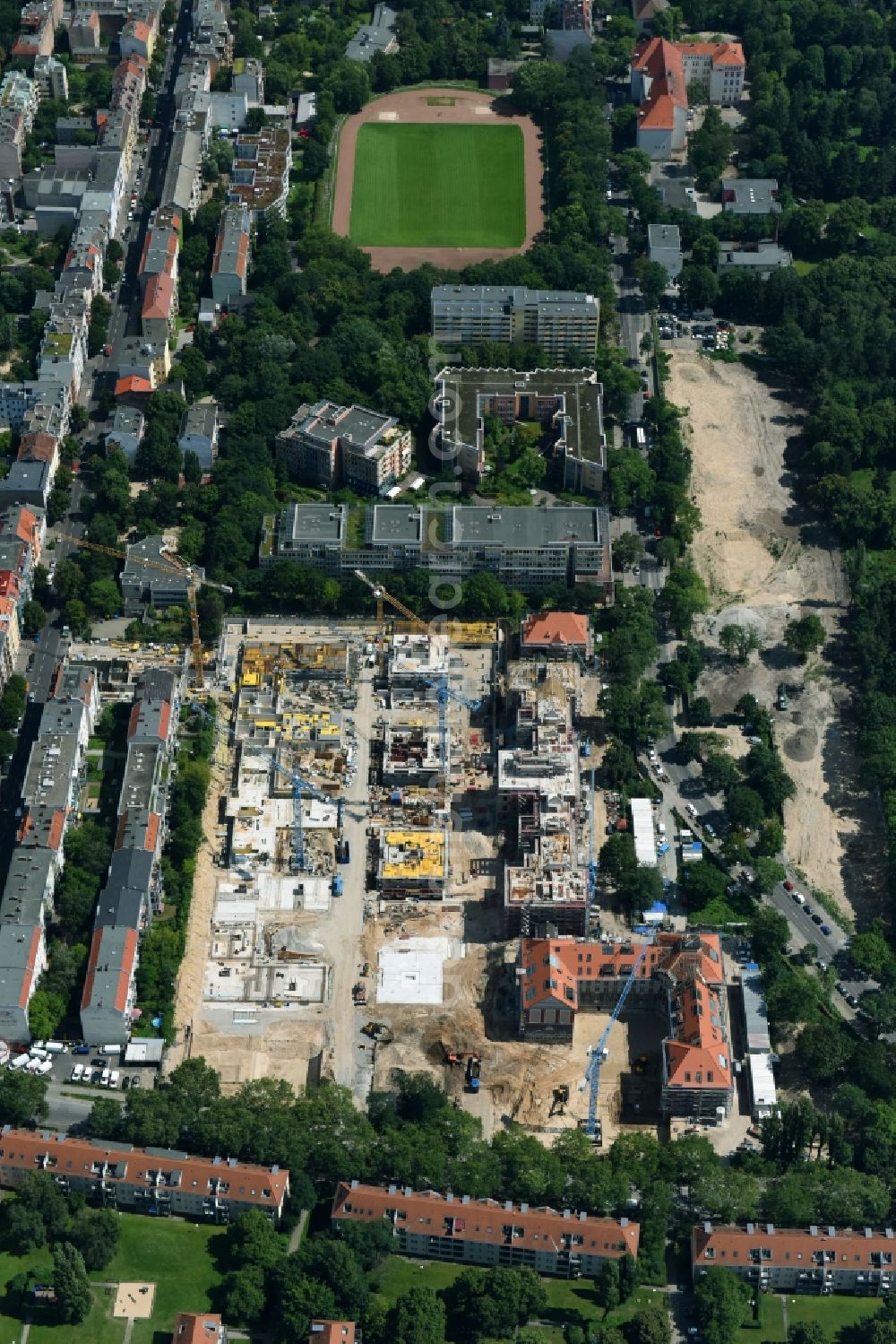 Berlin from the bird's eye view: Construction for the reconstruction and expansion of the old buildings listed building of AVILA Projektmanagement GmbH on Mariendorfer Weg in the district Neukoelln in Berlin