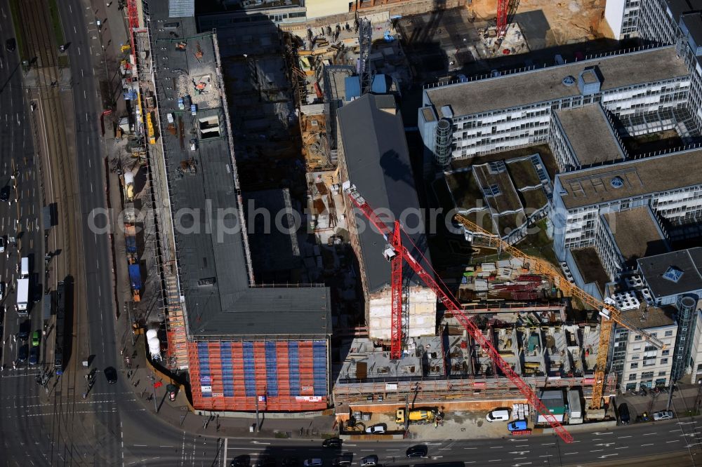 Leipzig from the bird's eye view: Construction for the reconstruction and expansion of the old buildings listed building of Firma REINBAU GmbH on Georgiring corner Grimmaischer Steinweg and Querstrasse in the district Mitte in Leipzig in the state Saxony