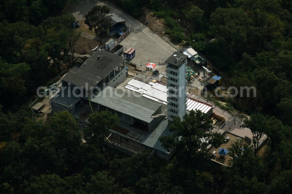 Aerial photograph Berlin - Site for the reconstruction of the tower- building ensemble of Mueggelturm in the forest Mueggelbergen Koepenick in Berlin