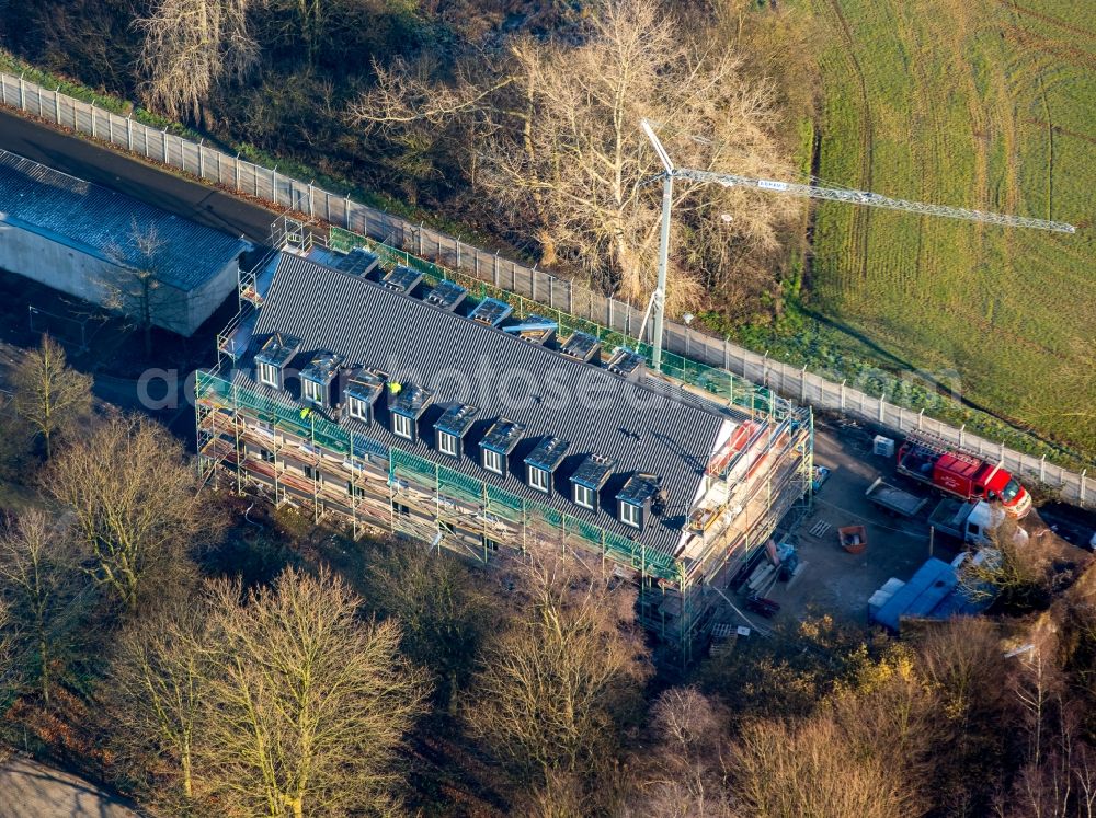 Aerial photograph Hamm - Construction site for reconstruction of a tree-lined apartment building in Hamm in the state North Rhine-Westphalia