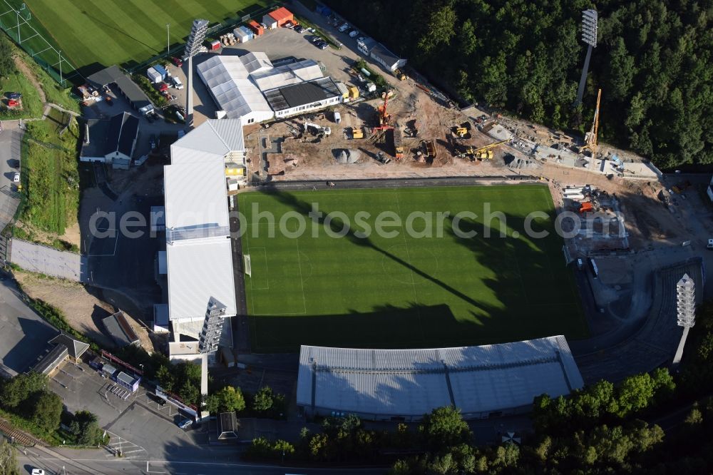 Aue from the bird's eye view: Construction for the reconstruction of the Sparkassen-Erzgebirgsstadium of the FC Aue at the Auer Strasse in Aue in the state Saxony. building owner is the Erzgebirgskreis. The working group Stadium Aue includes ASSMANN BERATEN + PLANEN GmbH, Buero bpp, Inros Lackner and Phase 10