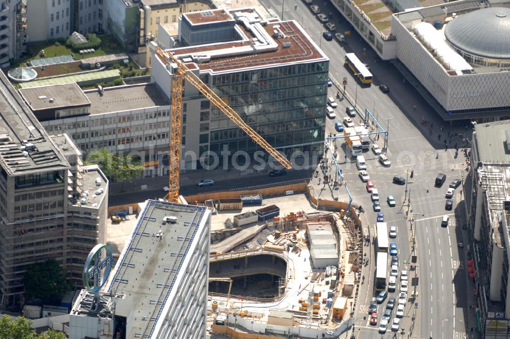 Aerial photograph Berlin - Blick auf die Baustelle zum Zoofenster Hochhaus am Hardenbergplatz.Das Zoofenster ist ein im Bau befindliches Hochhausprojekt in Berlin-Charlottenburg am Hardenbergplatz. Die Grundsteinlegung erfolgte am 27. März 2009. Die Bausubstanz soll in der Höhe 118 m betragen. Das Gebäude soll neben Einzelhandelsläden in den unteren Geschossen hauptsächlich ein Hotel der Marke Waldorf-Astoria beherbergen, welches voraussichtlich 242 Zimmer bieten wird. Als Fertigstellungstermin für das zweithöchste Hochhaus im Berliner Westen wird Ende 2011 anvisiert. ALPINE BAU