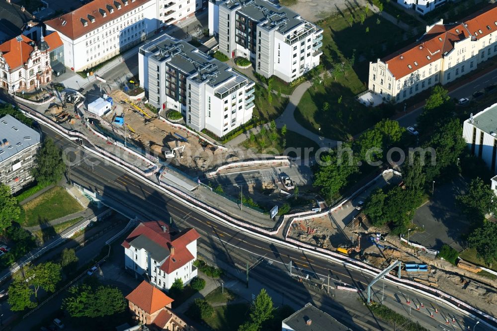 Rostock from the bird's eye view: Construction site for the renewal and rehabilitation of the road of Ernst-Barlach-Strasse in Rostock in the state Mecklenburg - Western Pomerania, Germany