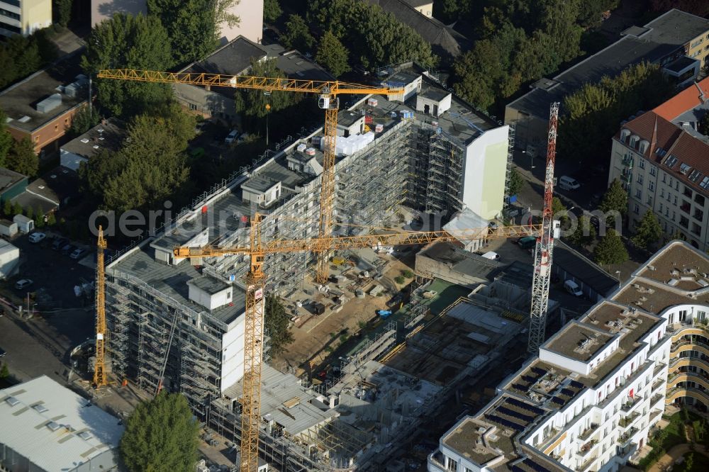 Berlin from the bird's eye view: View on the construction site of a new build for multiple apartments and industrial facilities in the Haasestrasse in Berlin in Germany. The project is commissioned by the Baugemeinschaft Haasestrasse GbR mbH to the mib - maerkische ingenieur bau gmbh and the pro.b Projektentwicklung & Projektsteuerung GmbH & Co. KG