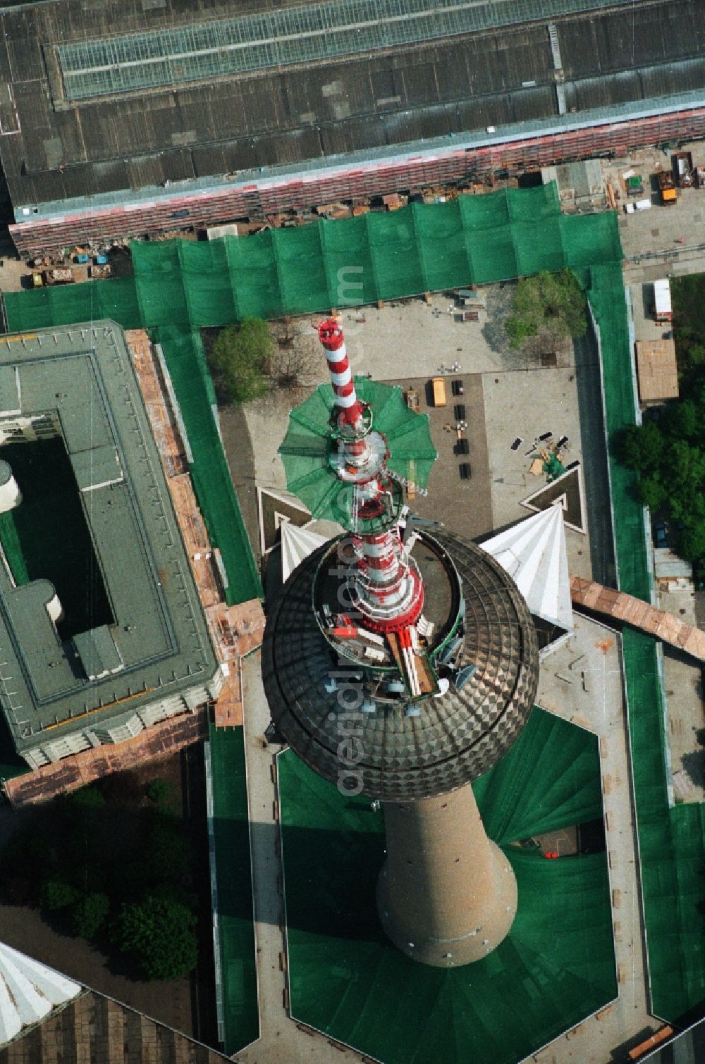 Berlin Mitte from the bird's eye view: Construction site for the extension and increase of the antenna carrier-mast on the ball of the Berlin TV Tower in Berlin - Mitte