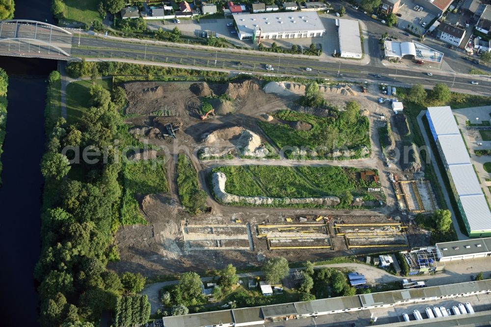 Aerial photograph Berlin - Construction site of the extension of the asylum seekers accommodations on Haarlemer Strasse in the Britz part of the district of Neukoelln in Berlin. The area next to the asylum seekers and refugee buildings are being newly developed