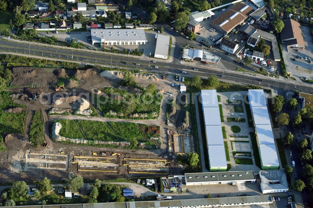 Aerial image Berlin - Construction site of the extension of the asylum seekers accommodations on Haarlemer Strasse in the Britz part of the district of Neukoelln in Berlin. The area next to the asylum seekers and refugee buildings are being newly developed