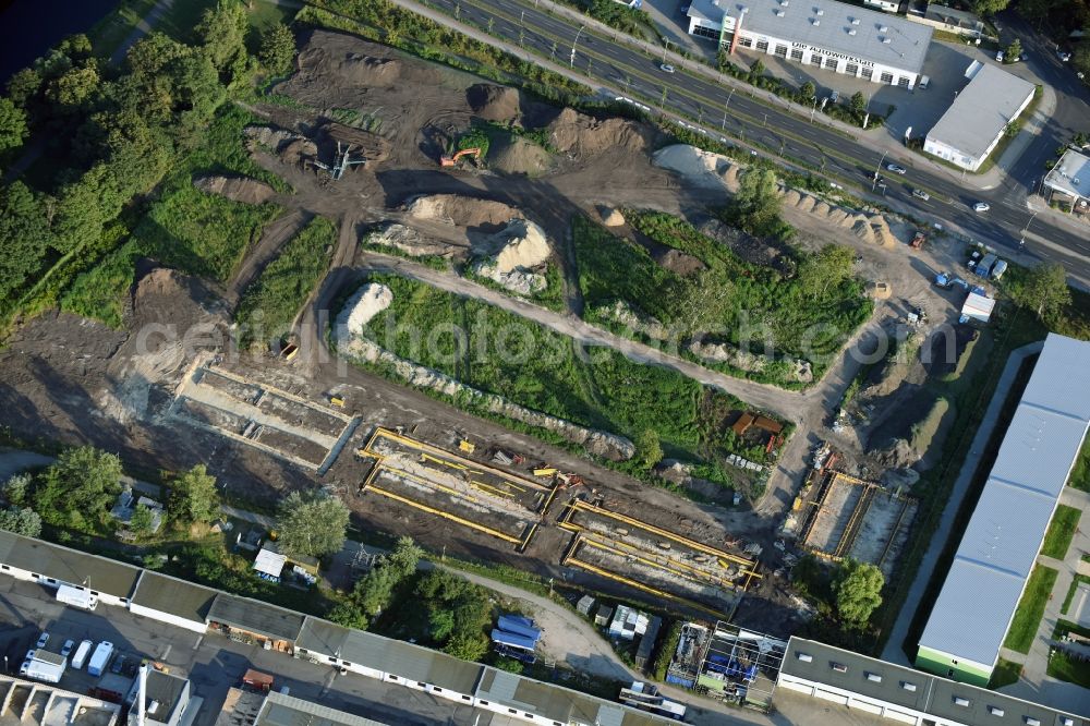 Berlin from above - Construction site of the extension of the asylum seekers accommodations on Haarlemer Strasse in the Britz part of the district of Neukoelln in Berlin. The area next to the asylum seekers and refugee buildings are being newly developed