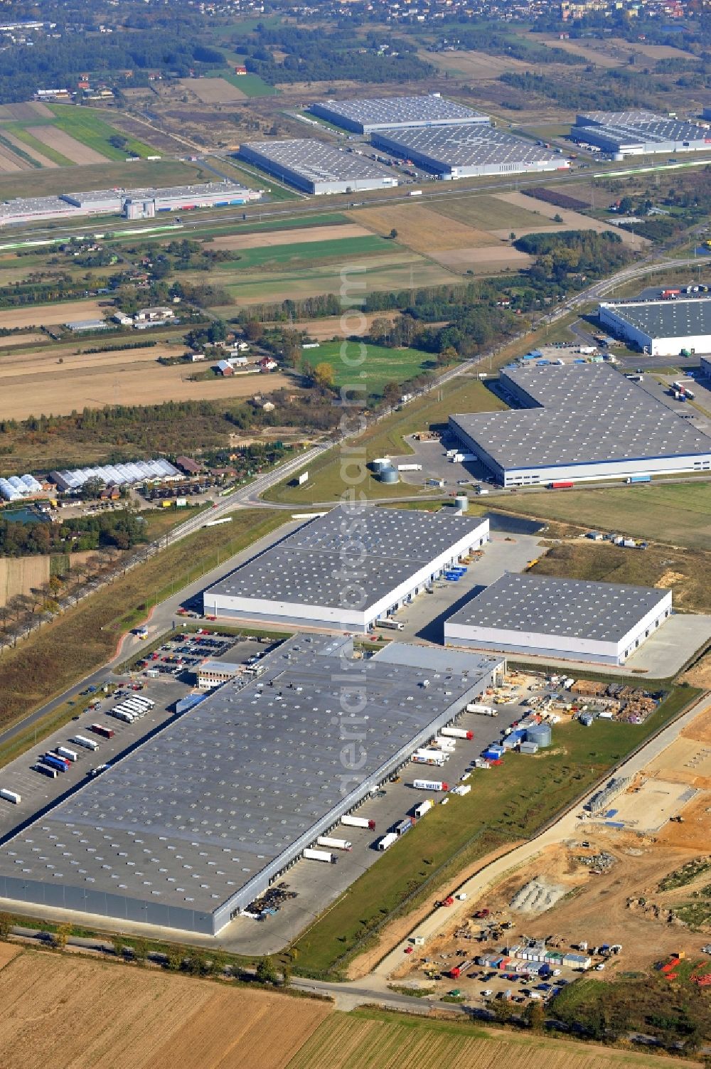 Strykow from the bird's eye view: View of a construction site for the expansion of warehouse and production space Tulipan Park in Strykow in the Lodz