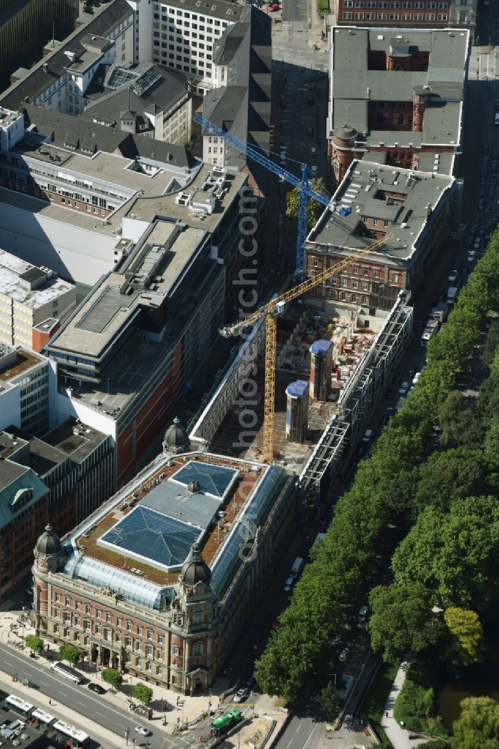 Hamburg from above - Construction site for the redevelopment of the historical post office complex Alte Post am Stephansplatz in Hamburg. The historical complex is being redeveloped and regenerated and new office and commercial units of Work Life Center are being built