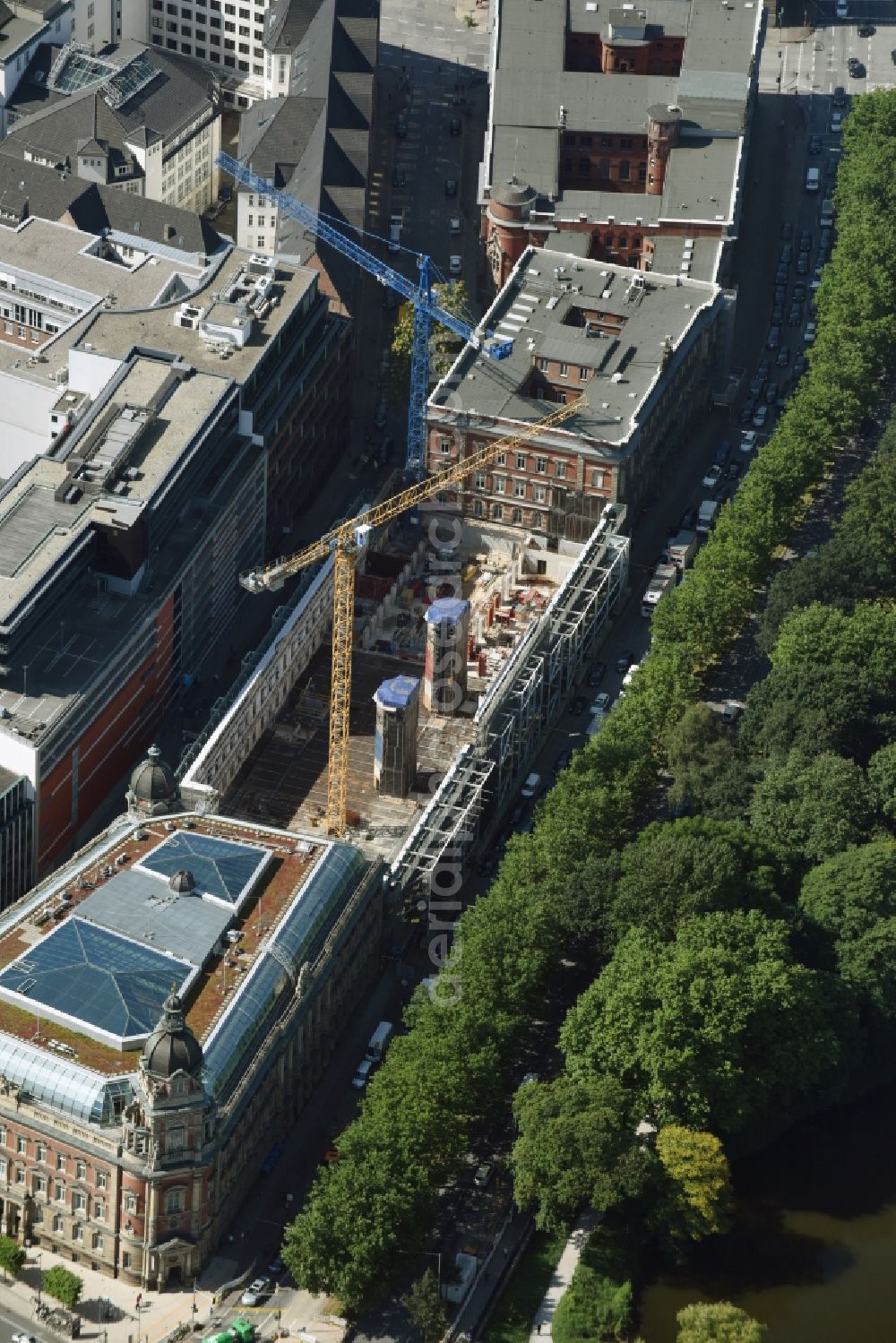 Hamburg from the bird's eye view: Construction site for the redevelopment of the historical post office complex Alte Post am Stephansplatz in Hamburg. The historical complex is being redeveloped and regenerated and new office and commercial units of Work Life Center are being built