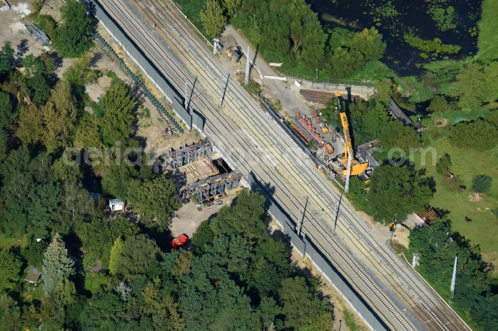 Berlin from above - Construction for the renovation of the railway bridge building to route the train tracks of Linie S3 between den Bahnhoefen Hirschgarten and Friedrichshagen beim Neuenhagener Muehlenfliess in Berlin, Germany