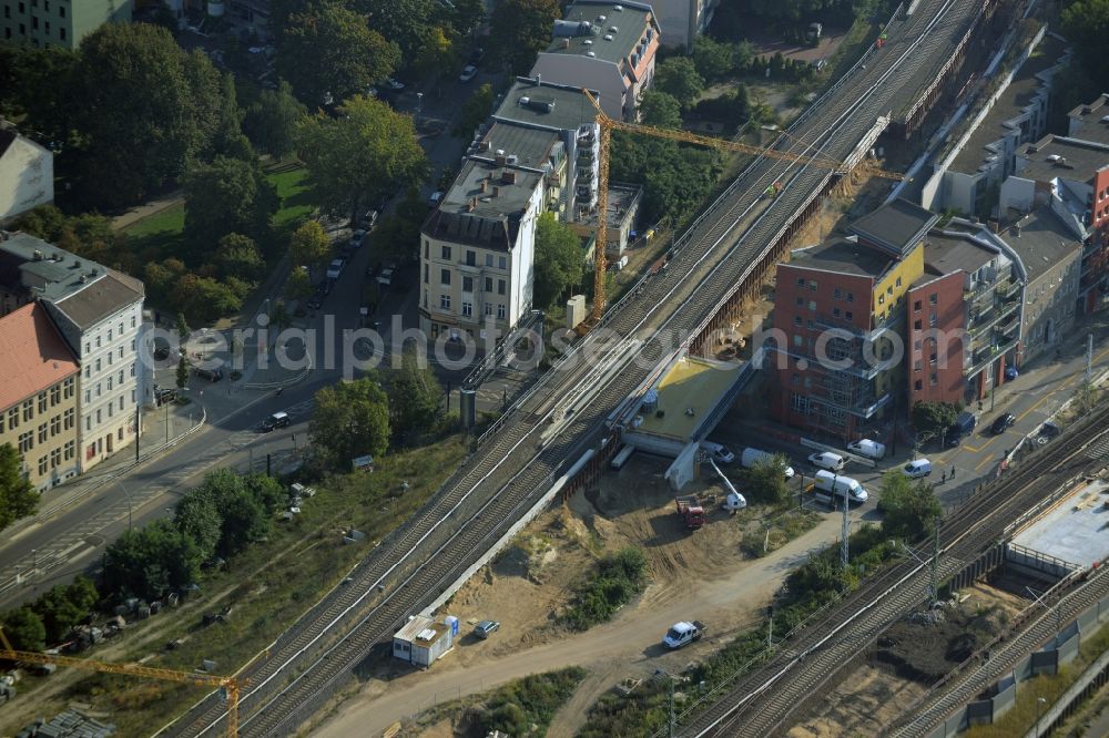 Berlin from the bird's eye view: Construction for the renovation of the railway bridge building to route the train tracks an der Karlshorster Strasse in Berlin in Germany