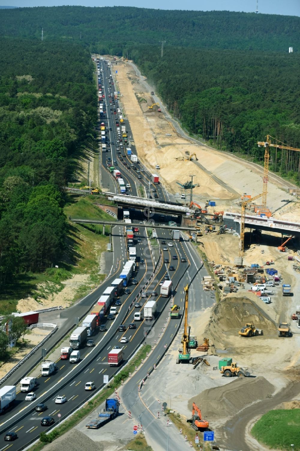 Michendorf from above - Construction for the renovation of the railway bridge building to route the train tracks crossing course of motorway BAB A10 in Michendorf in the state Brandenburg