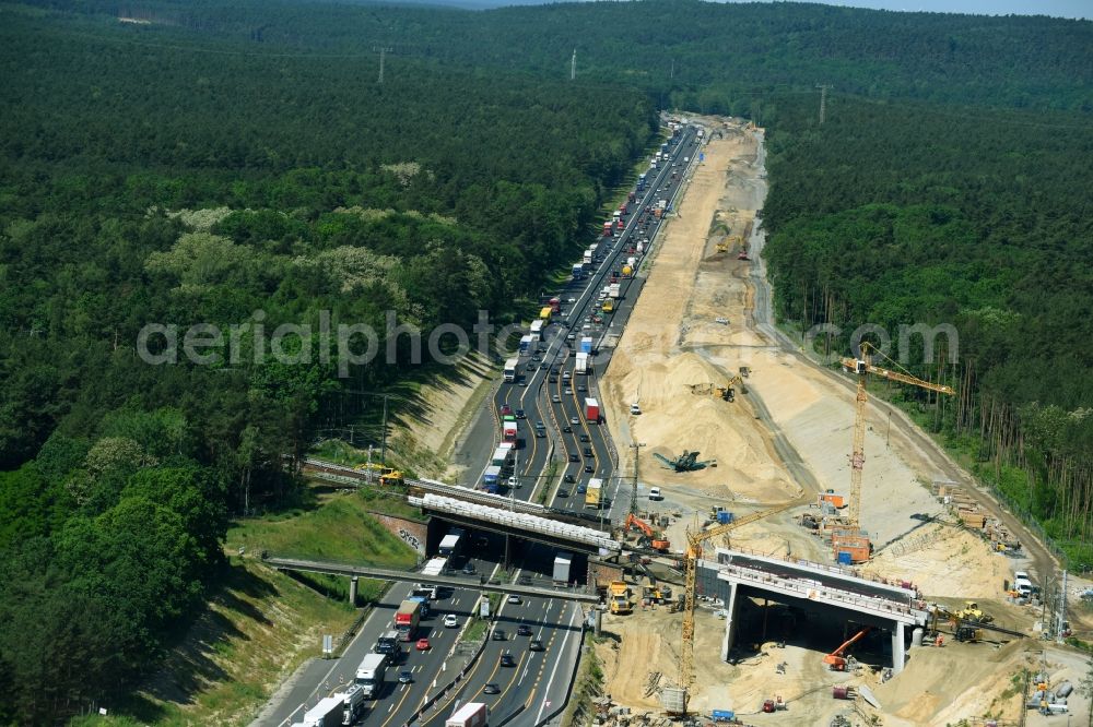 Aerial image Michendorf - Construction for the renovation of the railway bridge building to route the train tracks crossing course of motorway BAB A10 in Michendorf in the state Brandenburg