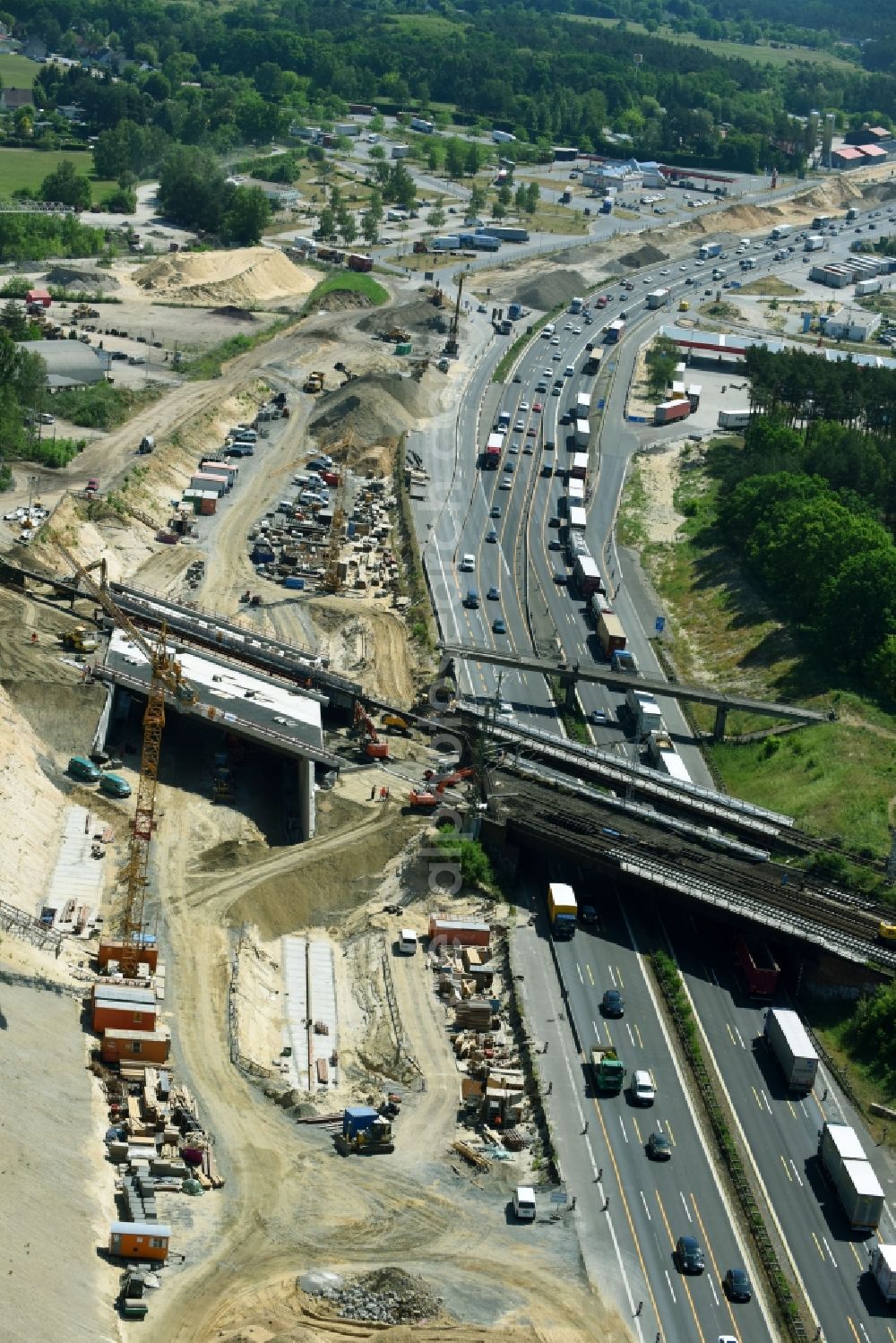 Aerial photograph Michendorf - Construction for the renovation of the railway bridge building to route the train tracks crossing course of motorway BAB A10 in Michendorf in the state Brandenburg