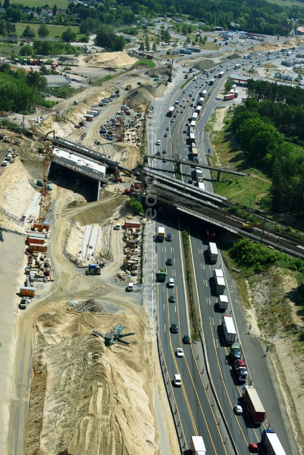 Michendorf from above - Construction for the renovation of the railway bridge building to route the train tracks crossing course of motorway BAB A10 in Michendorf in the state Brandenburg