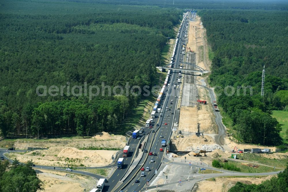 Michendorf from above - Construction for the renovation of the railway bridge building to route the train tracks crossing course of motorway BAB A10 in Michendorf in the state Brandenburg