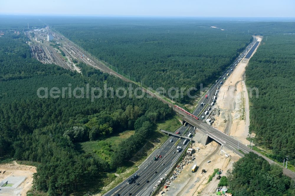 Aerial photograph Michendorf - Construction for the renovation of the railway bridge building to route the train tracks crossing course of motorway BAB A10 in Michendorf in the state Brandenburg