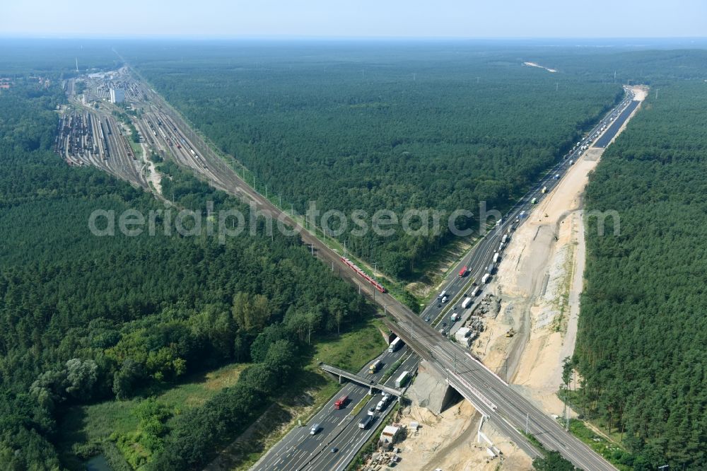 Michendorf from above - Construction for the renovation of the railway bridge building to route the train tracks crossing course of motorway BAB A10 in Michendorf in the state Brandenburg