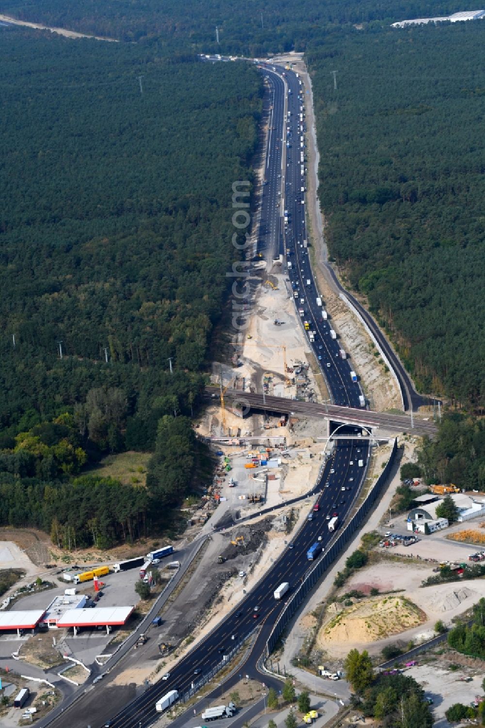 Michendorf from above - Construction for the renovation of the railway bridge building to route the train tracks crossing course of motorway BAB A10 in Michendorf in the state Brandenburg