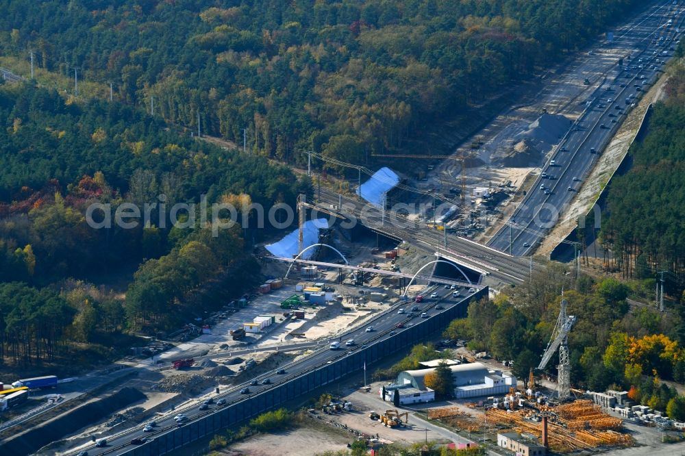 Aerial photograph Michendorf - Construction for the renovation of the railway bridge building to route the train tracks crossing course of motorway BAB A10 in Michendorf in the state Brandenburg