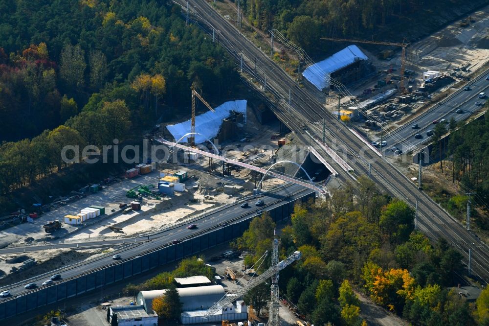 Michendorf from above - Construction for the renovation of the railway bridge building to route the train tracks crossing course of motorway BAB A10 in Michendorf in the state Brandenburg