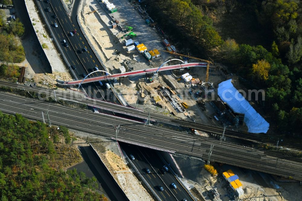 Aerial photograph Michendorf - Construction for the renovation of the railway bridge building to route the train tracks crossing course of motorway BAB A10 in Michendorf in the state Brandenburg