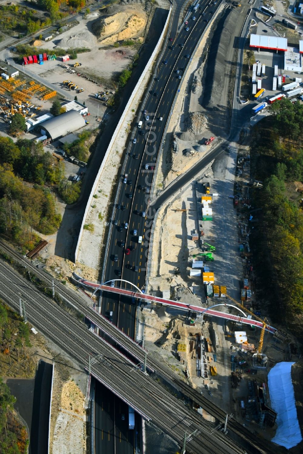 Michendorf from the bird's eye view: Construction for the renovation of the railway bridge building to route the train tracks crossing course of motorway BAB A10 in Michendorf in the state Brandenburg