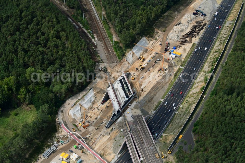 Aerial image Michendorf - Construction for the renovation of the railway bridge building to route the train tracks crossing course of motorway BAB A10 in Michendorf in the state Brandenburg