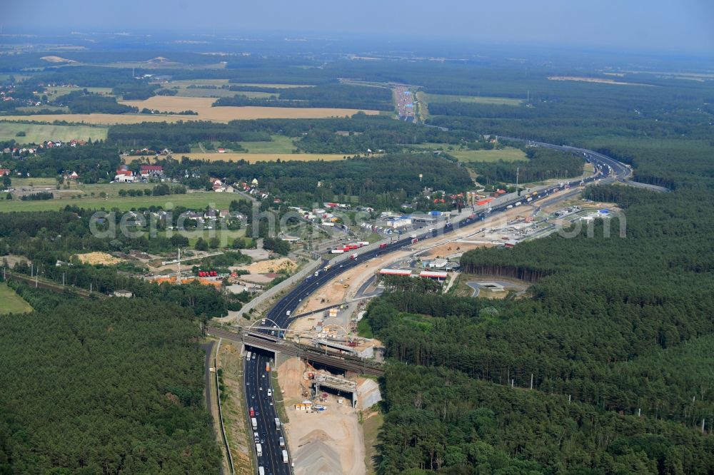 Aerial photograph Michendorf - Construction for the renovation of the railway bridge building to route the train tracks crossing course of motorway BAB A10 in Michendorf in the state Brandenburg