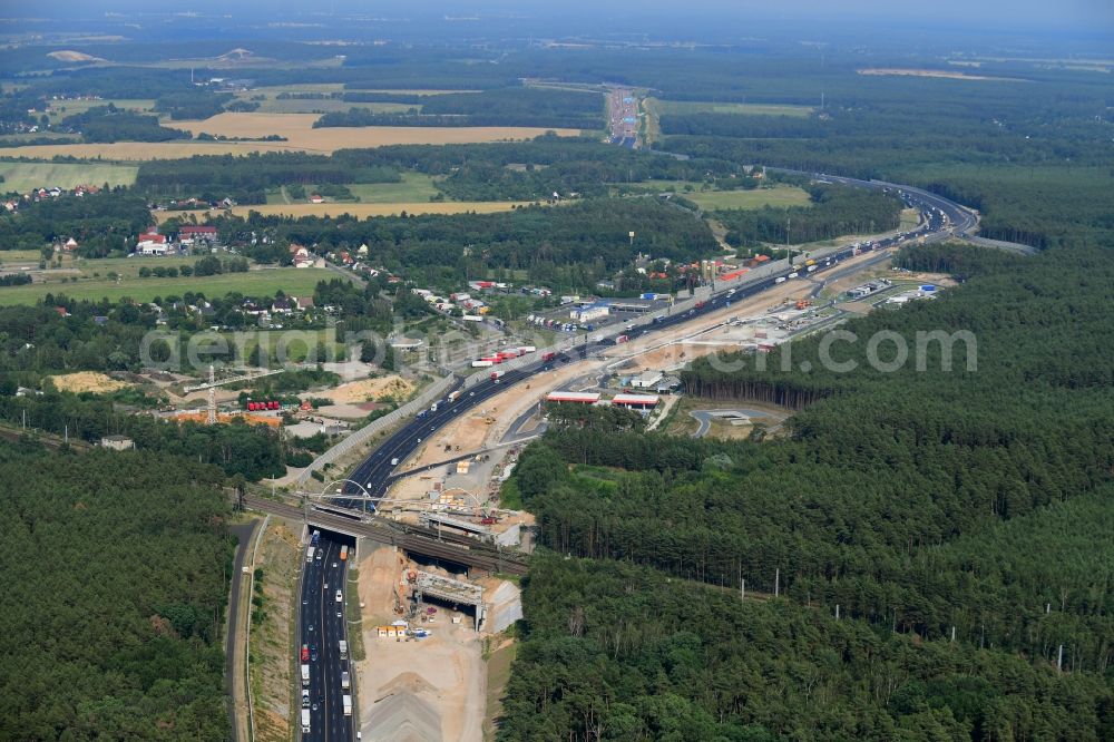 Michendorf from above - Construction for the renovation of the railway bridge building to route the train tracks crossing course of motorway BAB A10 in Michendorf in the state Brandenburg